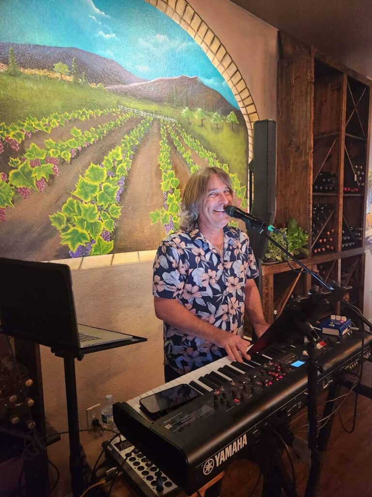 Musician Bill Fredericks playing live at UnWINEd